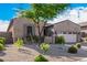 Two-story house with a large tree and a gravel front yard at 12064 S 186Th Ave, Goodyear, AZ 85338