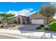 House exterior with a two-car garage and drought-tolerant landscaping at 12064 S 186Th Ave, Goodyear, AZ 85338