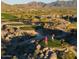 Aerial view of a golf course with mountain backdrop at 12064 S 186Th Ave, Goodyear, AZ 85338