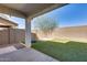 An outdoor covered patio with faux grass, a trampoline, and privacy walls at 1255 N Arizona Ave # 1255, Chandler, AZ 85225