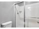 This bathroom features a glass-enclosed shower and a white toilet at 1255 N Arizona Ave # 1255, Chandler, AZ 85225