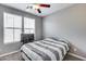 This bedroom features gray walls, two windows with blinds, and a ceiling fan at 1255 N Arizona Ave # 1255, Chandler, AZ 85225