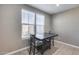 Cozy dining area with natural light from windows, featuring a dark wood table and seating at 1255 N Arizona Ave # 1255, Chandler, AZ 85225