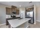 Beautiful kitchen featuring a quartz island, stainless steel appliances, and ample cabinet space at 1255 N Arizona Ave # 1255, Chandler, AZ 85225