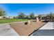 Community playground area featuring play structures, set within a spacious green space at 1255 N Arizona Ave # 1255, Chandler, AZ 85225