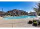 A refreshing community pool, surrounded by lounge chairs and lush greenery at 1255 N Arizona Ave # 1255, Chandler, AZ 85225