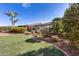 Landscaped backyard with artificial turf and mature trees at 12629 W Bajada Rd, Peoria, AZ 85383