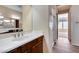 Elegant bathroom featuring a vanity with a single sink and a shower stall at 12629 W Bajada Rd, Peoria, AZ 85383