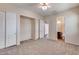 Bright bedroom with ensuite bathroom and ceiling fan at 12629 W Bajada Rd, Peoria, AZ 85383