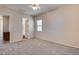 Well lit bedroom with ensuite bathroom and ceiling fan at 12629 W Bajada Rd, Peoria, AZ 85383