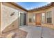 Courtyard entry with wood door and sliding glass door at 12629 W Bajada Rd, Peoria, AZ 85383