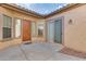 Bright courtyard entry with wood door and sliding glass doors at 12629 W Bajada Rd, Peoria, AZ 85383