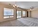 Spacious dining room with carpet flooring, large windows and built in shelving at 12629 W Bajada Rd, Peoria, AZ 85383