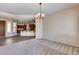 Open dining area with a view of the kitchen and a chandelier at 12629 W Bajada Rd, Peoria, AZ 85383