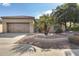 Single story home with two car garage and palm trees at 12629 W Bajada Rd, Peoria, AZ 85383