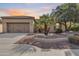 Beautiful desert landscaping highlights this single-story home with a two-car garage at 12629 W Bajada Rd, Peoria, AZ 85383