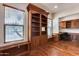 Home office with built-in shelving and hardwood floors at 12629 W Bajada Rd, Peoria, AZ 85383