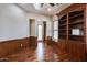 Home office with built-in bookcase and hardwood floors at 12629 W Bajada Rd, Peoria, AZ 85383