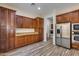 Kitchen features ample wood cabinetry, granite countertops, and stainless steel appliances at 12629 W Bajada Rd, Peoria, AZ 85383