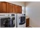 Laundry room with washer, dryer, and ample cabinet space at 12629 W Bajada Rd, Peoria, AZ 85383