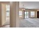 View of living room, hardwood and carpeted floors, and access to backyard at 12629 W Bajada Rd, Peoria, AZ 85383