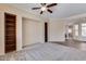 Home office with built-in bookshelves and hardwood floors at 12629 W Bajada Rd, Peoria, AZ 85383