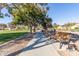 Park with walking path, bench, and mature trees at 1349 N Balboa --, Mesa, AZ 85205