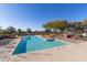 Sparkling community pool with lounge chairs and covered seating at 1349 N Balboa --, Mesa, AZ 85205