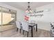 Elegant dining area with a chandelier and seating for four at 1349 N Balboa --, Mesa, AZ 85205