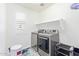 Laundry room with washer, dryer, and shelving at 1349 N Balboa --, Mesa, AZ 85205