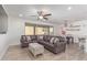 Spacious living room with L-shaped sectional sofa and wood-look floors at 1349 N Balboa --, Mesa, AZ 85205