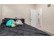 Bedroom with full-size bed, plush bedding and plenty of light at 14836 W Desert Hills Dr, Surprise, AZ 85379