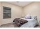 Charming bedroom with a full-size bed and plush bedding at 14836 W Desert Hills Dr, Surprise, AZ 85379