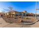 House with a large front yard, gravel landscaping, and a circular driveway at 14836 W Desert Hills Dr, Surprise, AZ 85379