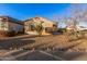 One-story house with a cactus and mature desert landscaping in the front at 14836 W Desert Hills Dr, Surprise, AZ 85379