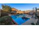 Relaxing pool area with lounge chair and inflatable ring at 14836 W Desert Hills Dr, Surprise, AZ 85379