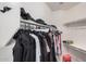 Large walk-in closet with shelves and hanging rods at 14836 W Desert Hills Dr, Surprise, AZ 85379