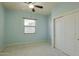 Well-lit bedroom with ceiling fan and double door closet at 14850 E Grandview Dr # 138, Fountain Hills, AZ 85268