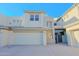 Close-up view of a modern condo's exterior, showcasing garage and architectural details at 14850 E Grandview Dr # 138, Fountain Hills, AZ 85268