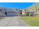 Front view of a modern condo with two-car garage and landscaped lawn at 14850 E Grandview Dr # 138, Fountain Hills, AZ 85268