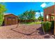 swing set and storage shed in a landscaped backyard at 16205 S 7Th St, Phoenix, AZ 85048