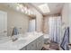 Clean bathroom with double vanity, bathtub, and skylight at 16205 S 7Th St, Phoenix, AZ 85048