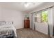 Cozy bedroom with a full-size bed and a vintage dresser at 16205 S 7Th St, Phoenix, AZ 85048