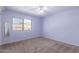 Spacious bedroom with carpet and a large window at 16205 S 7Th St, Phoenix, AZ 85048