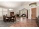 Formal dining room with a large wood table and tile floors at 16205 S 7Th St, Phoenix, AZ 85048