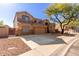 Two-story house with a large three-car garage and landscaped front yard at 16205 S 7Th St, Phoenix, AZ 85048