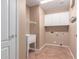 Laundry room with cabinets, sink, and tile floor at 16205 S 7Th St, Phoenix, AZ 85048