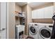 Laundry room with washer, dryer, and utility sink at 16205 S 7Th St, Phoenix, AZ 85048