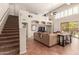 Two story living room with a staircase and built-in shelving at 16205 S 7Th St, Phoenix, AZ 85048