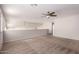 Spacious loft area features carpet and ceiling fan at 16205 S 7Th St, Phoenix, AZ 85048